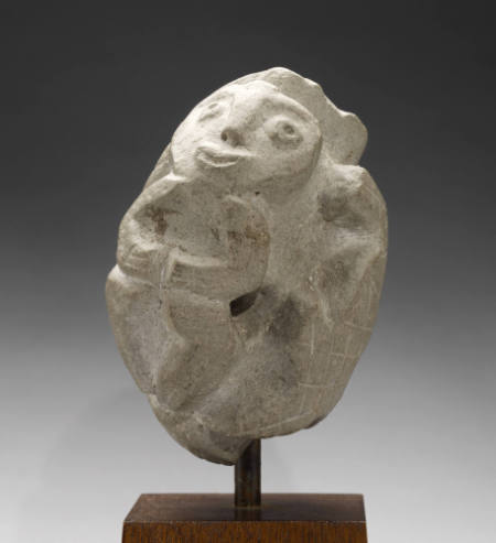 Human with two reptiles stone carving