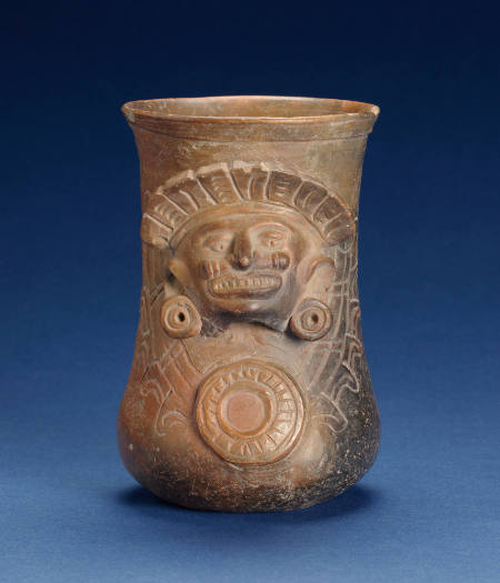Vase With Human Face Relief