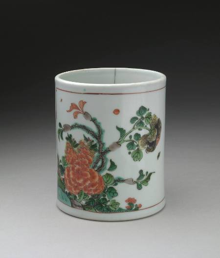 Brush holder with two reserves, one showing peonies, the other showing hibiscus blossoms