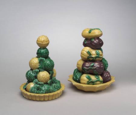 Decorative object representing gourds stacked in a dish with fluted rim