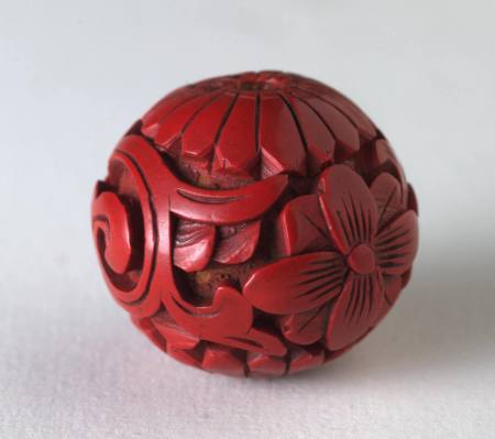 Ojime with design of chrysanthemum and plum blossom