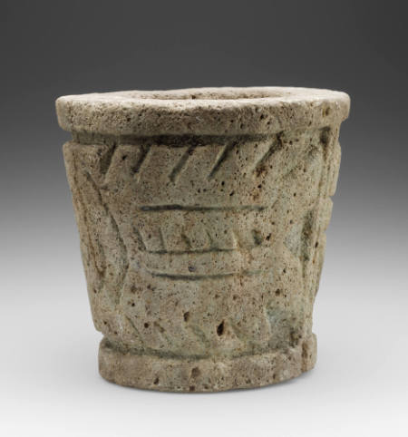 Cylindrical carved pedestal