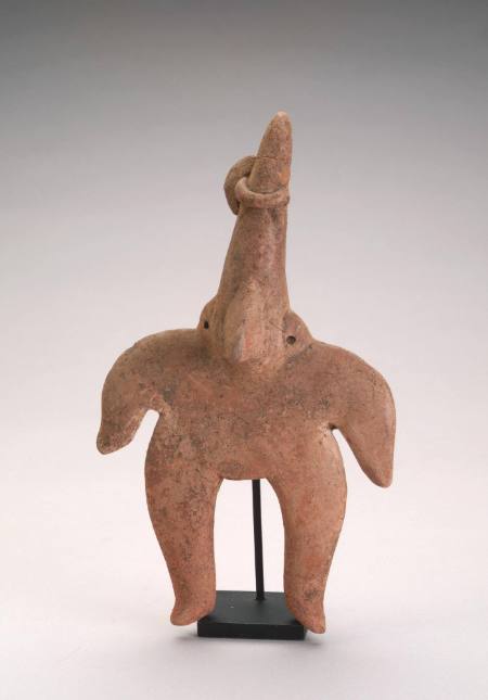 Flat figure with pointed head, large nose, and ear holes