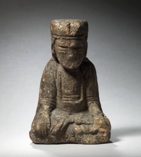 Seated roadside shrine figure