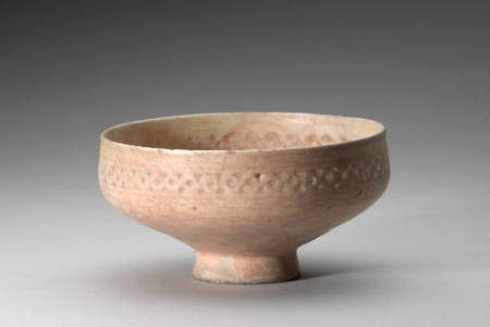 Bowl with pierced intertwining design