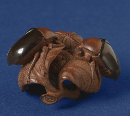 Netsuke of two beetles on leaves