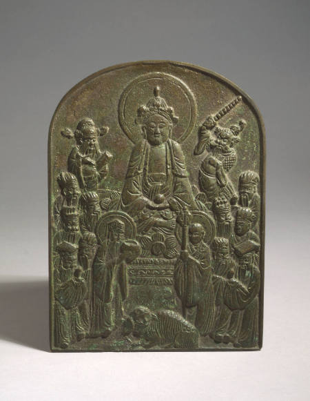 Plaque of seated Daoist deity with attendants and lion
