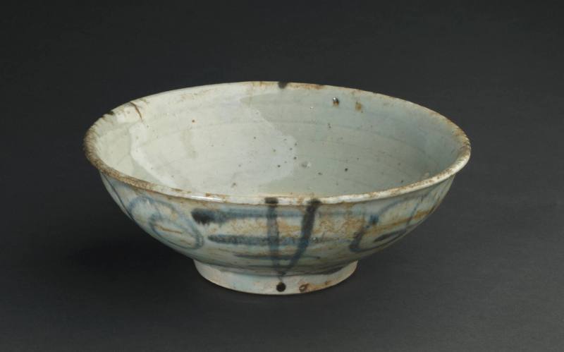 Deep bowl with scrolling motifs alternating with linear motifs