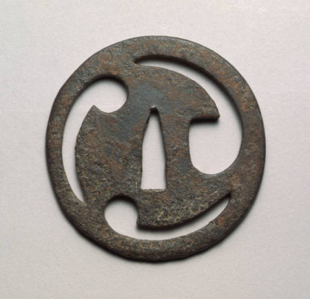 Tsuba cut with three comma-shaped designs
