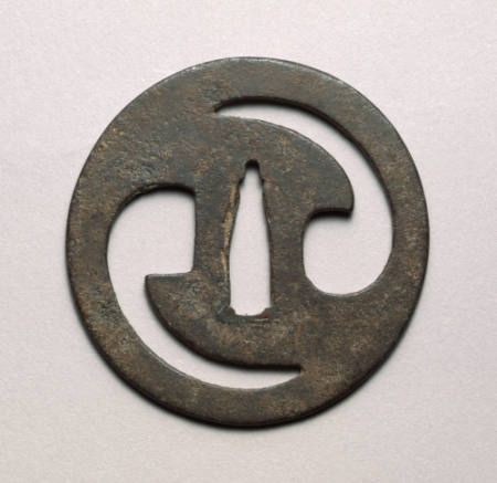 Tsuba cut with tow comma-shaped designs (tomo-e)