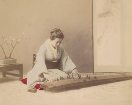 [Woman playing koto]