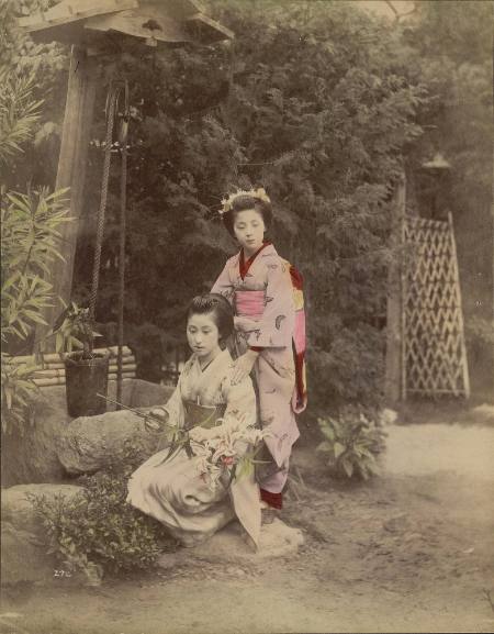 [Two women at a well with lilies]
