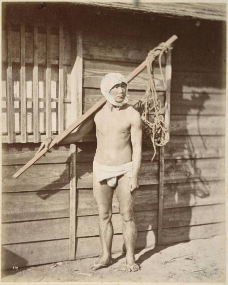 [Man with pole and rope net bag]