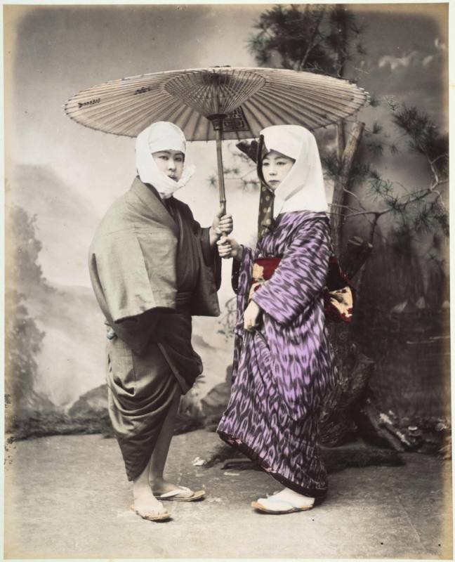 [Couple under an umbrella]