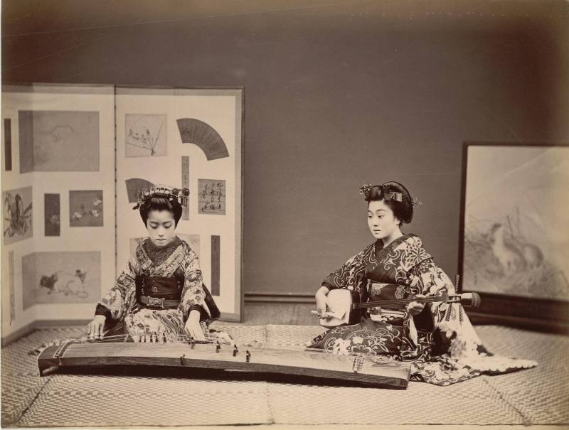 [Two women playing instruments]