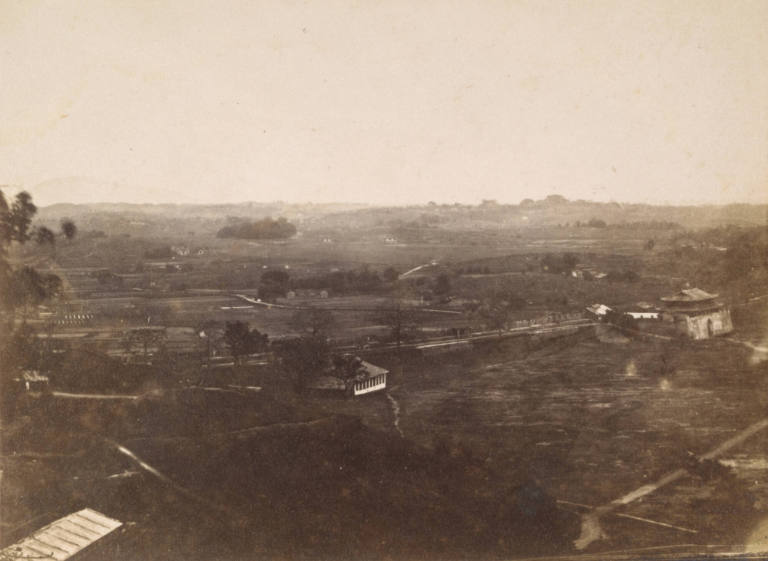 [Landscape with buildings and grove of trees]