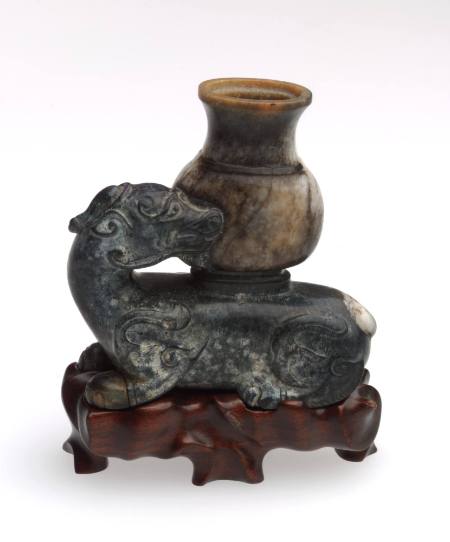 Reclining ch'i-lin with vase