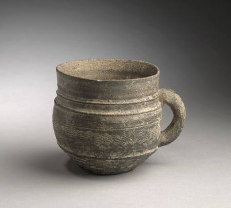 Cup with handle and incised lines