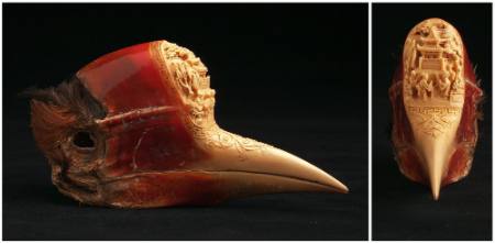 Skull of a helmeted hornbill with carved landscape scenery