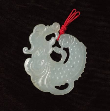 Jade pendant in shape of coiled dragon