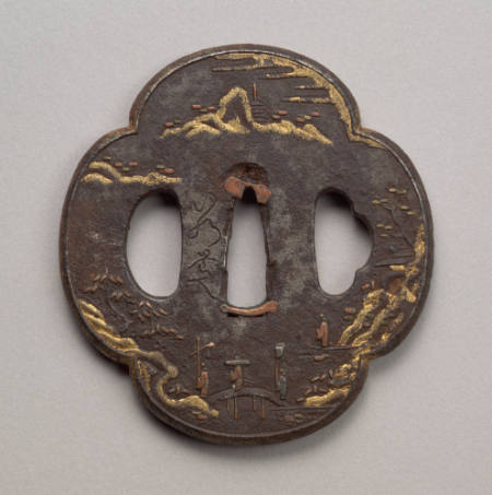Quadrefoil iron tsuba inlaid in gold with a landscape scene.  Signed.