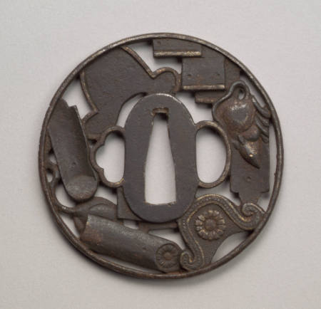 Round iron tsuba with openwork.  Subject is books, scrolls, a rat.