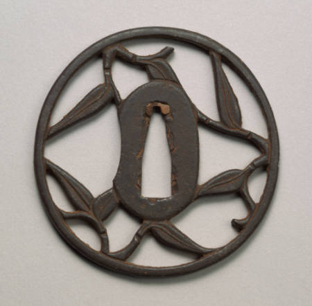 Round Sukashi iron tsuba. The design is a reticulated bamboo leaf.