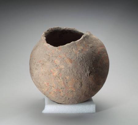 Spherical vessel with red geometric designs