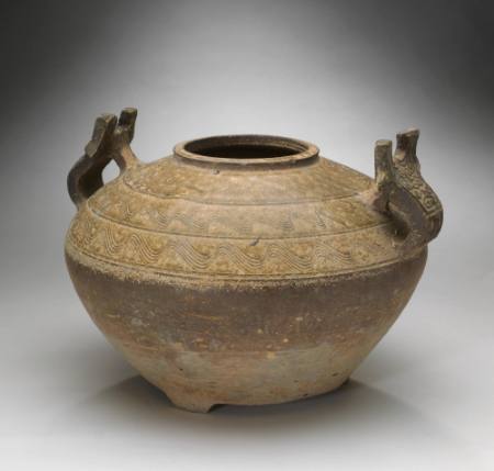Jar with two animal mask handles and incised wave pattern