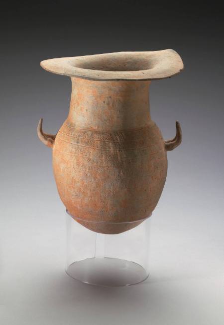 Jar with horn-shaped handles and incised designs