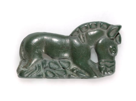 Plaque in the form of a kneeling horse