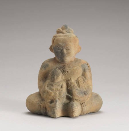 Seated figure holding child and rooster