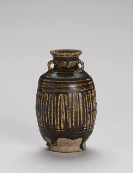 Small, brown-glazed two-eared jar