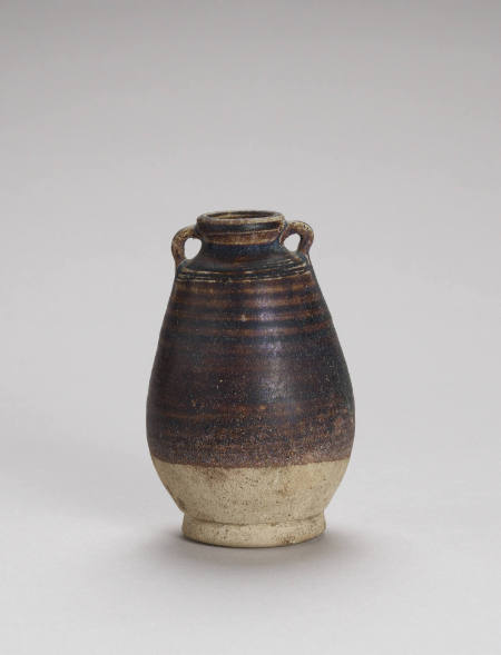 Small, brown-glazed two-eared jar