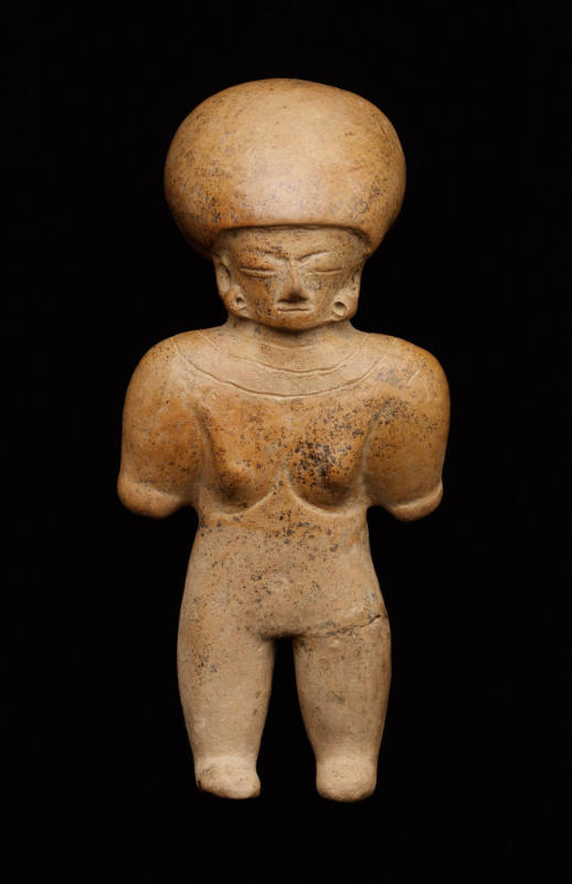 Standing helmeted figure