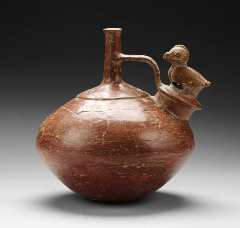 Bridge-spouted vessel with bird whistle