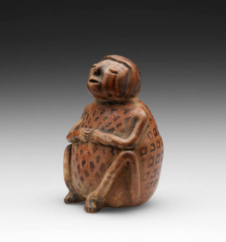 Seated person chewing coca ("Coquero")