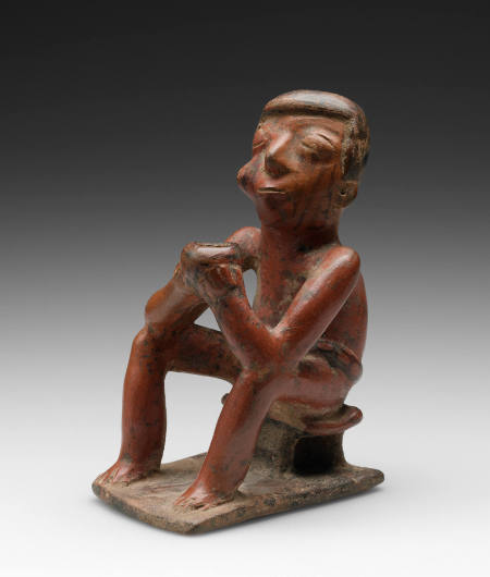 Seated male Coquero
