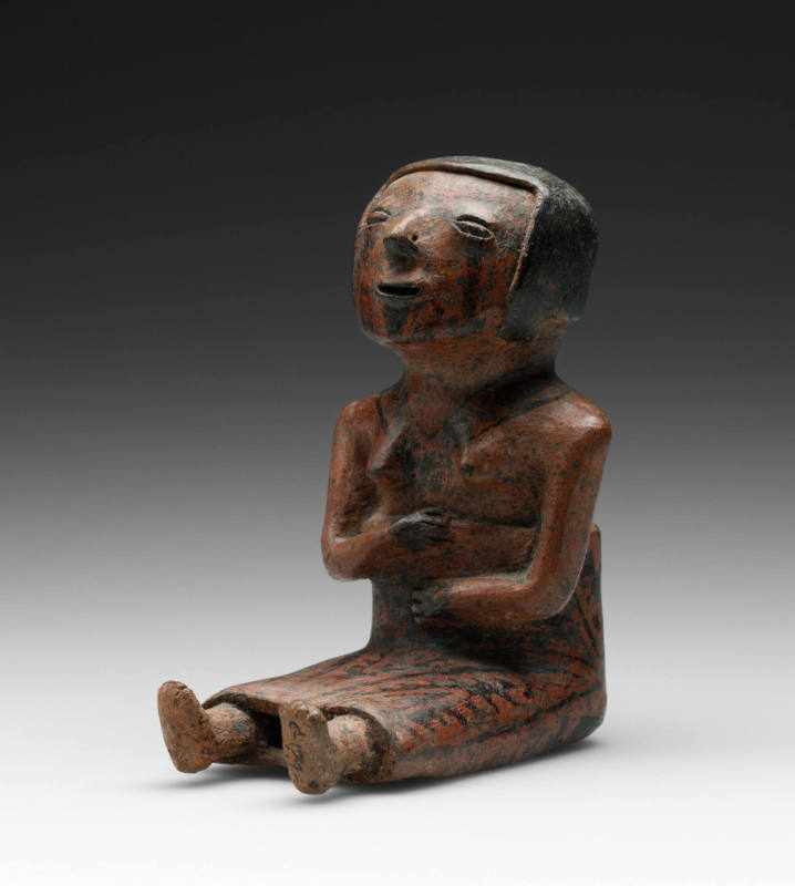 Seated female Coquero