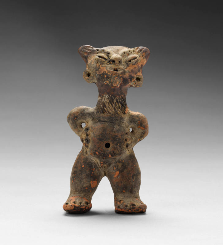 Feline-headed figure