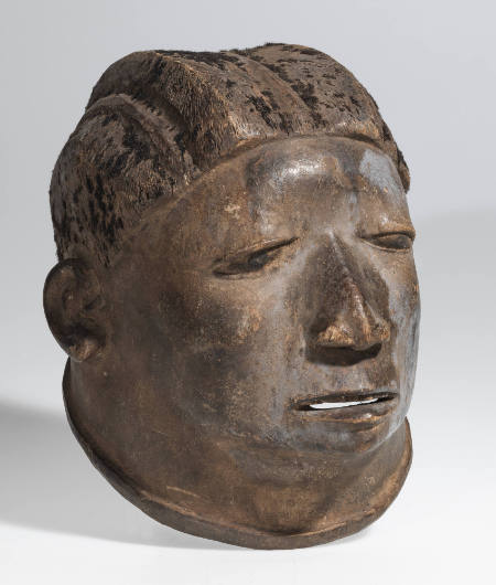 "Lipiko" mask of a middle-aged woman with horizontal ears and scattered tufts of short hair