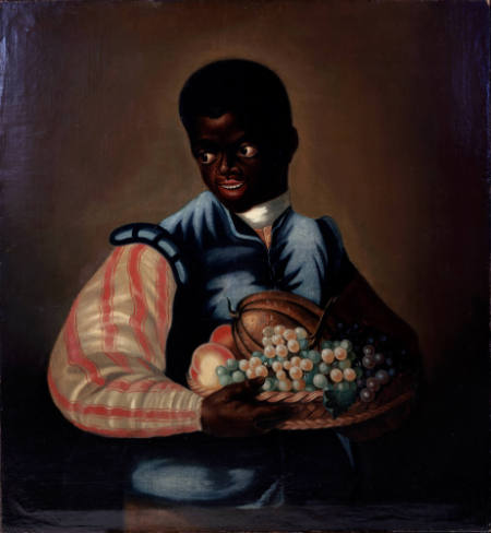 Boy with a basket of fruit