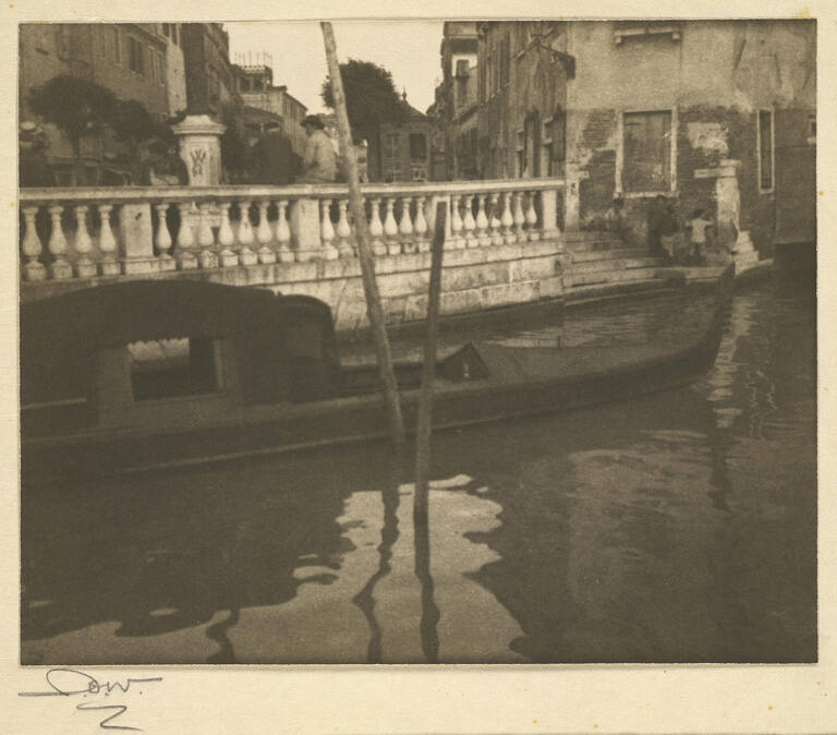 [Canal in Venice with gondola]