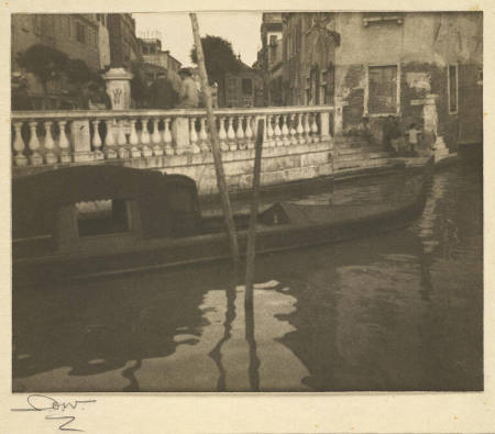 [Canal in Venice with gondola]