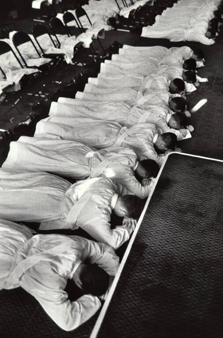 [Ceremony of Ordination; Priests-to-be lie prone in gesture of humility]