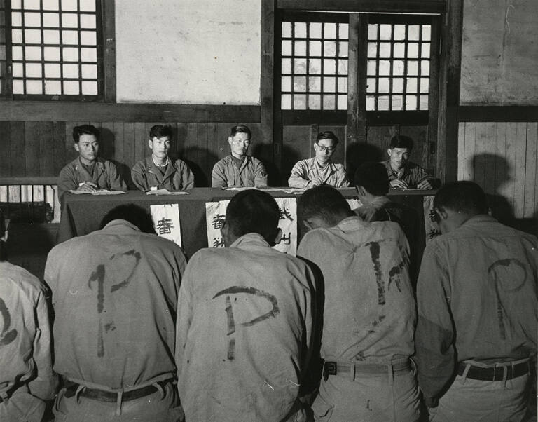 [Doomed Communists, captured by South Korean National Police, await execution]