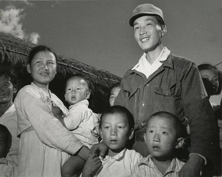 [Ex-guerilla Nim Churl-Jin is welcomed home by his wife and family and the baby he had never seen]