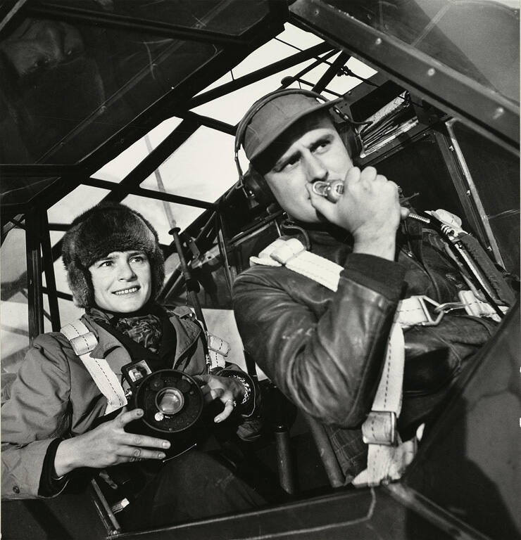 [Margaret Bourke-White in plane with pilot]