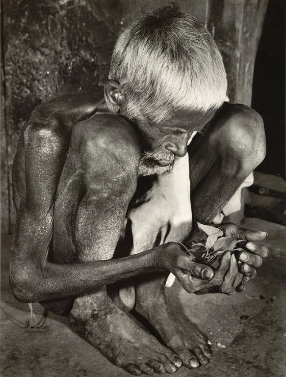 [Man in famine-stricken village, India]