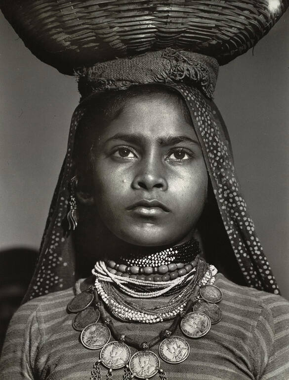 [Young Indian girl who lives in a fishing village on the sea coast near Bombay]